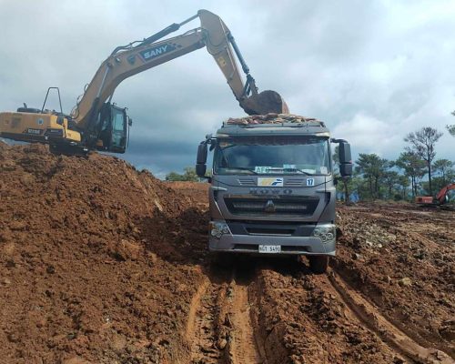 Backhoe with Truck on Mining